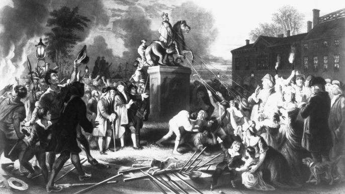 American colonists pull down a statue of King George III in New York City during the American Revolutio