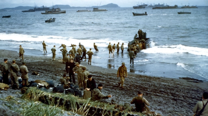 U.S. military personnel unloading supplies during a beach landing on the Aleutian Islands. (
