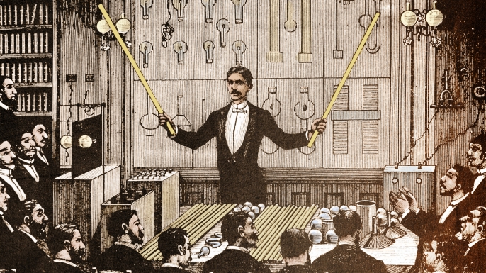 Nikola Tesla demonstrating alternating current electricity.