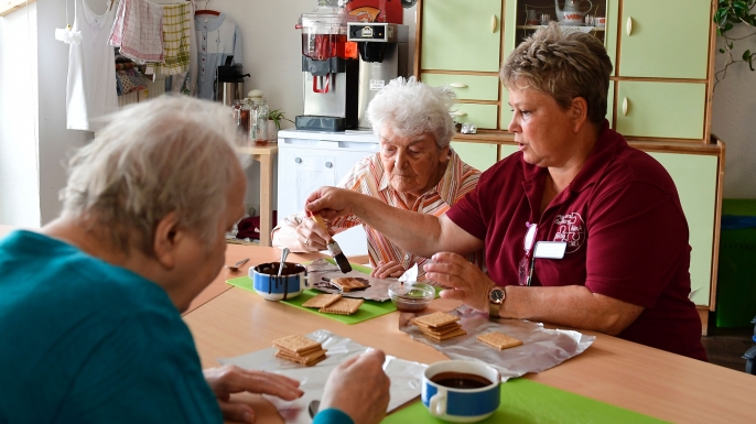 Residents prepare a former east German cake. (Credit: tobias Schwarz/AFP/Getty Images)