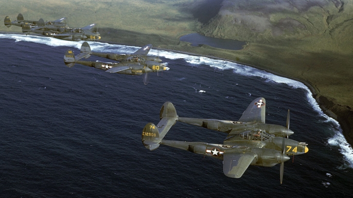 A squadron of American P-38 fighters in flight over the Aleutian Islands.