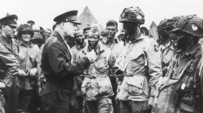 Allied Supreme Commander Dwight Eisenhower speaking with troops before the invasion of Normandy.