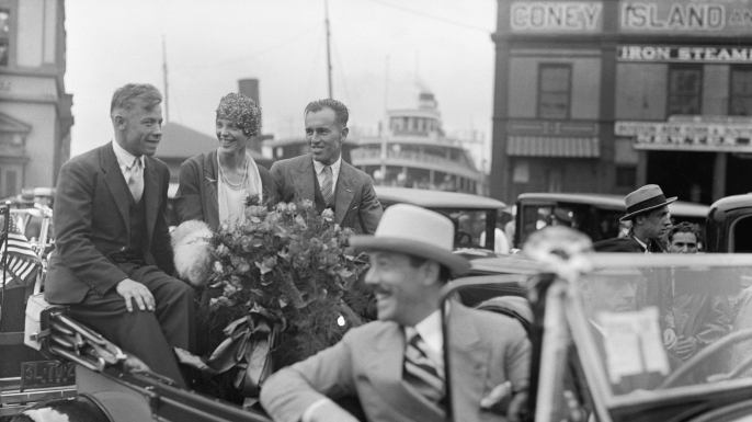 Amelia Earhart in a Parade reception after her Trans-Atlantic Flight in 1928 with pilots Wilmer Stultz and Luis Gordon. (Credit: Bettmann/Getty Images)