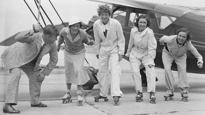Flyers Amelia Earhart Putnam, Frances H. Marsalis, Elvy Kalep, and Betty Gillies rehearsing for a skating party that was held in a hangar by the "Ninety Nines." (Credit: Bettmann/Getty Images)