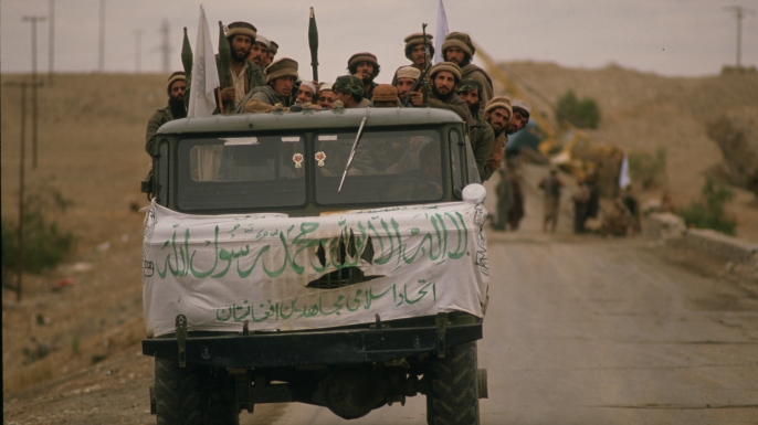 As part of their war against the Soviet forces invading Afghanistan, the Mujahidin, anti-Communist troops trained and supplied by the U.S.A., Saudi Arabia, Pakistan and other countries, have launched an offensive in the Jalalabad area. Pictured here is a truck full of armed Mujahidin soldiers arriving at the Samarkhel Mujahidin camp near the Jalalabad airport to back up the forces already present . (Credit: Patrick Durand/Sygma via Getty Images)