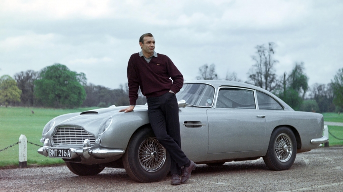 Sean Connery as James Bond with the Aston Martin in Goldfinger. (Credit: AF Archive/Alamy Photo)