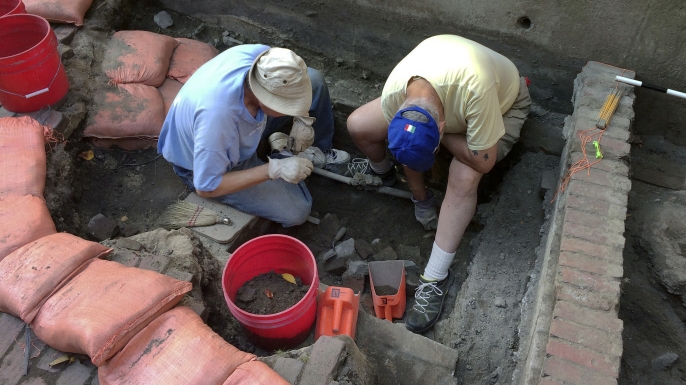 Boston Archaeological Program volunteers Tim Riordan and Bob Sartini excavate a site that experts believe may have contained an outhouse used by Paul Revere, September 28, 2017. (Credit: William J. Kole/AP Photo)