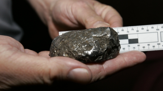 An object that crashed through the roof of a home in Freehold Township, N.J. Geologists ruled out the possibility of it being a meteorite, scientists say it is a stainless steel alloy that does not occur in nature and is most likely "orbital debris", perhaps remnants of a satellite, a rocket or some other spacecraft component. (Credit: Mike Derer/AP Photo)