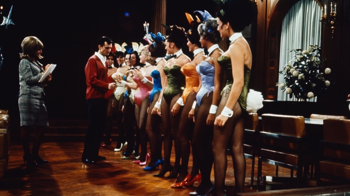 A group of Playboy Bunnies line up for inspection by Hugh Hefner. (Credit: Bettmann / Getty Images)