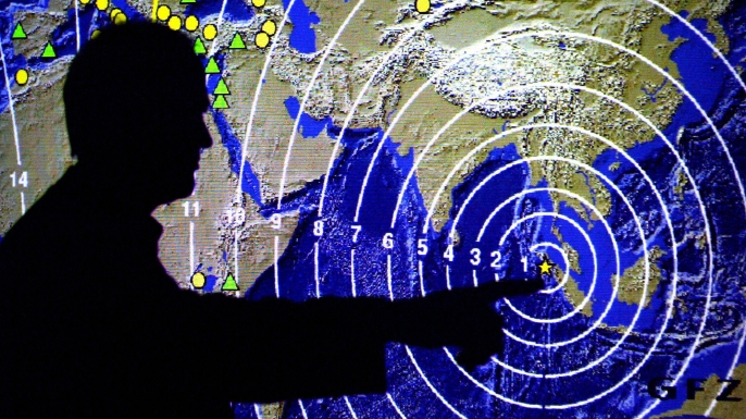 Map displaying the propagation of seismic waves after the Sumatra quake at the Geo Science Center in Potsdam. (Credit: Michael Urban/AFP/Getty Images)
