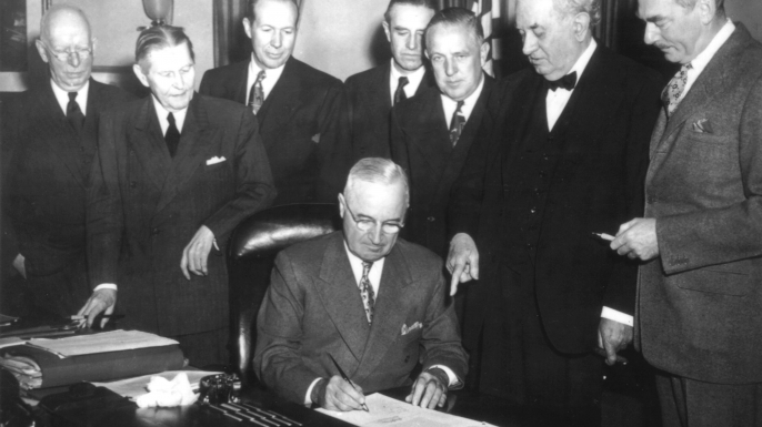 President Truman signs the Economic Assistance Act, a program for the reconstruction of Europe, known as the Marshall Plan. (Credit: Photo12/UIG via Getty Images)