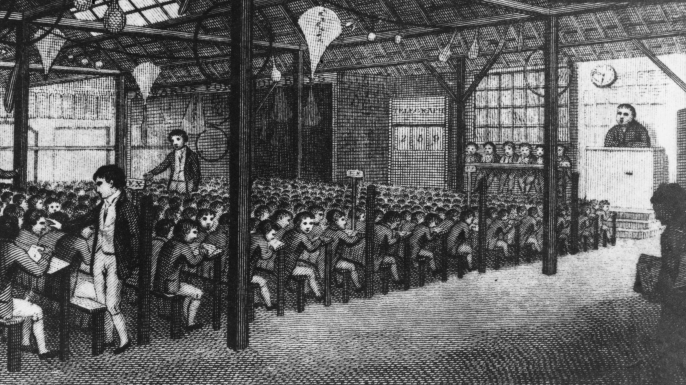 Senior boys instructing their juniors at a school under Joseph Lancaster's Monitorial System in the East End of London. (Credit: Rischgitz/Getty Images)