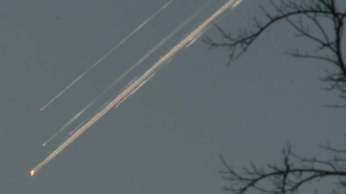 Debris from the space shuttle Columbia streaks across the Texas sky as seen from Dallas. (Credit: Jason Hutchinson/AP/REX/Shutterstock)