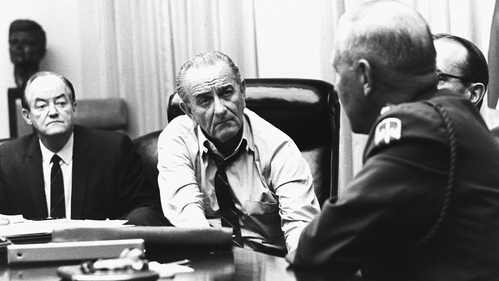 President Lyndon B. Johnson meeting with General Creighton Abrams to discuss the partial halt to bombings in North Vietnam in March, 1968. (Credit: Corbis/Getty Images)