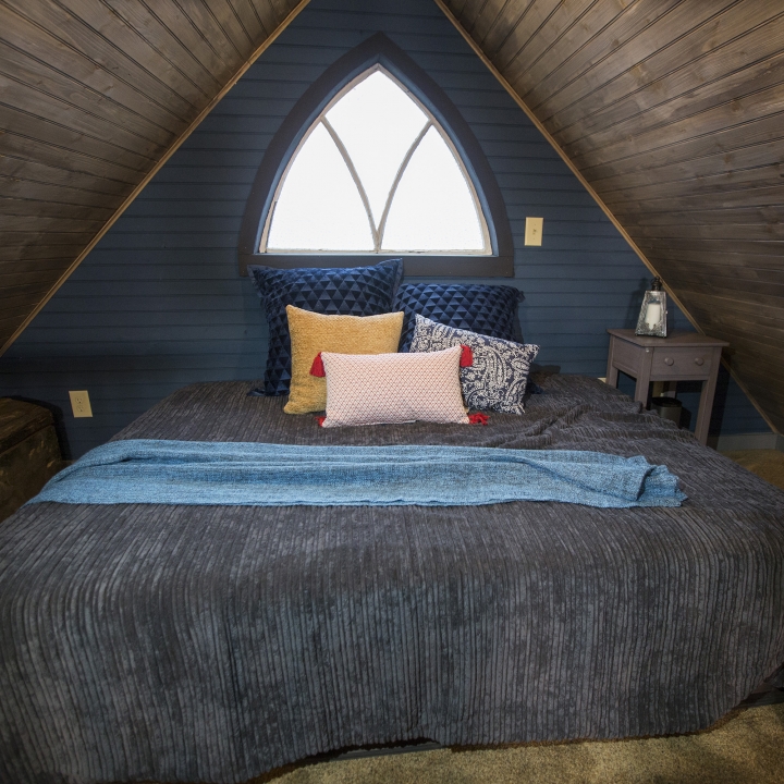 At the top of the staircase, the Rempis parents have the tiny antique bedroom of their dreams.