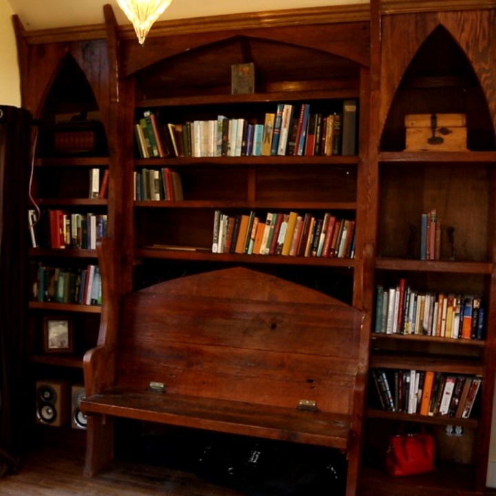 Adding storage and keeping the Gothic theme in tact, this bookcase brings a beautiful old-fashioned touch to the tiny house.