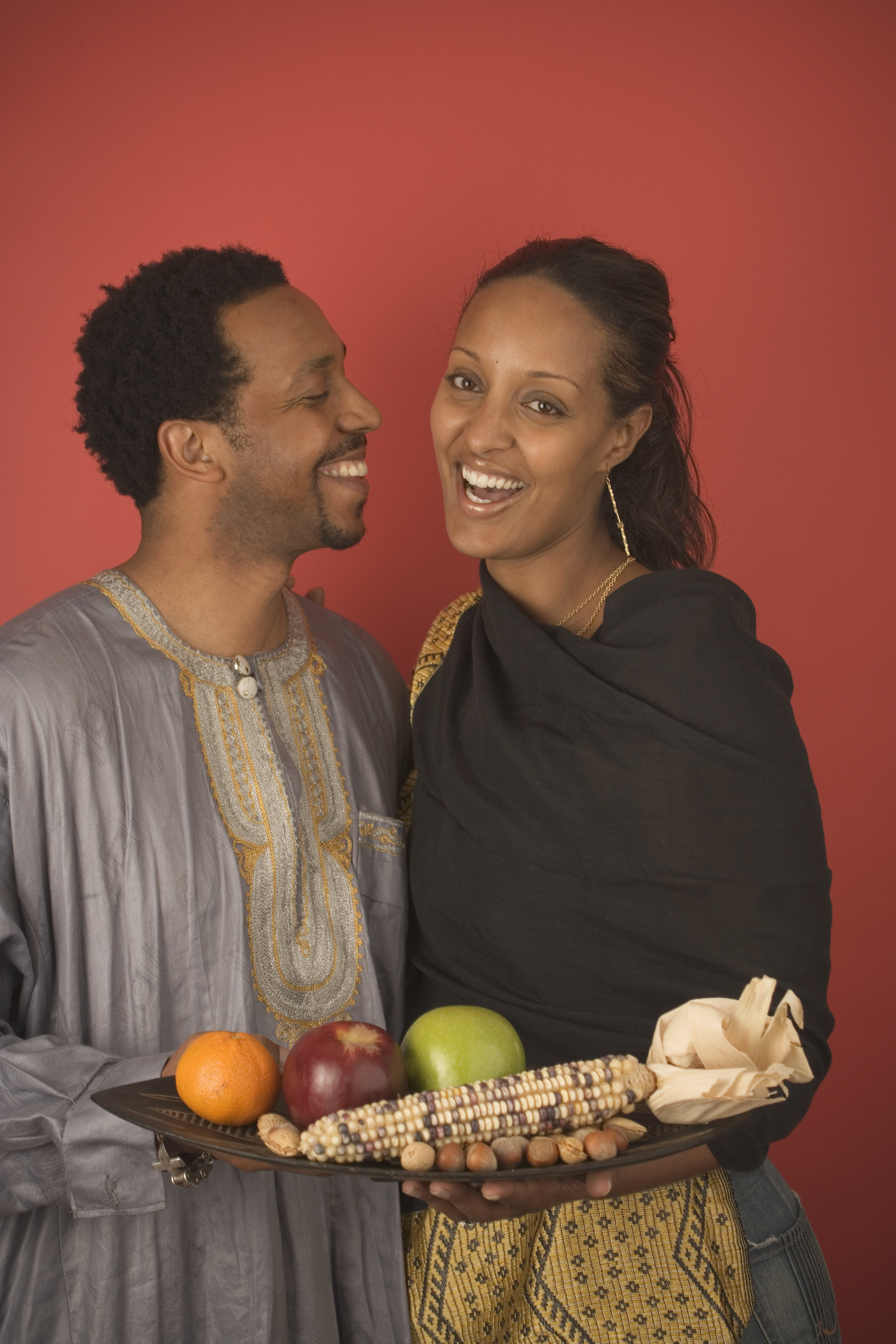 man-with-wrapped-gifts - Kwanzaa Pictures - Kwanzaa - HISTORY.com