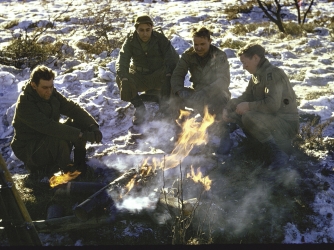 Soldiers of the 1st Army huddle around a campfire in the northern Ardennes Forest (Credit: George Silk/LIFE Picture Collection/Getty Images)