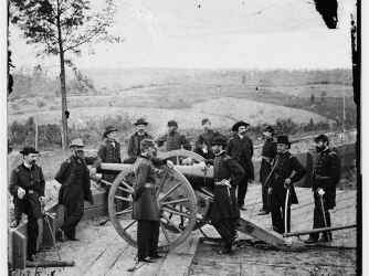 William T. Sherman (center, with arm on cannon) surveys the field during the siege of Atlanta.