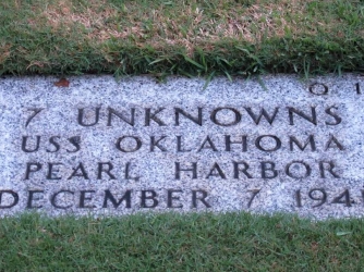 Gravestone identifying it as the resting place of seven unknowns from USS Oklahoma.