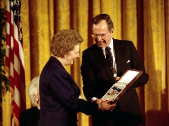 Receiving Presidential Medal Of Freedom. (Credit: George Bush Presidential Library)