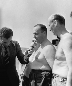 US Ambassador Duke (pictured on right) meets with reporters after staging a swimming photo-op in Palomares. (Credit: Gianni Ferrari/Cover/Getty Images)