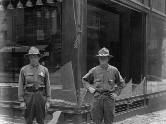 Store windows broken in Black Tom Explosion. (Credit: Bettmann / Getty Images)