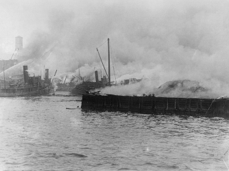 Fire raging at National Storage House, one of plants blown up by the explosion and spreading of fire. (Credit: Bettmann /Getty Images)