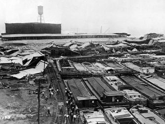 Wrecked warehouses and scattered debris attest to power of an explosion. (Credit: US Army Signal Corps / Getty Images)