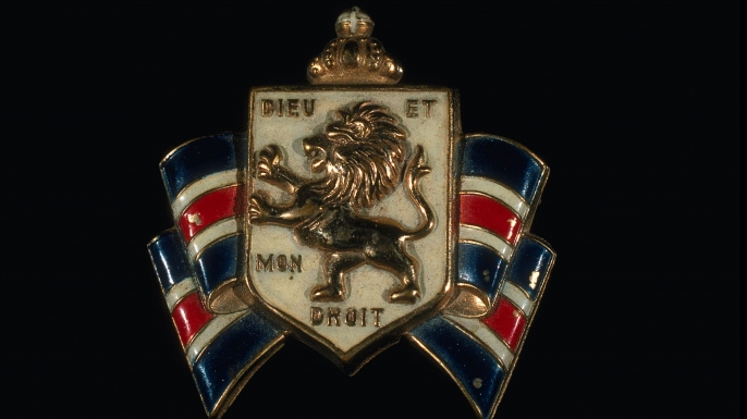 The British Coat of Arms bearing the motto "Dieu et mon droit."