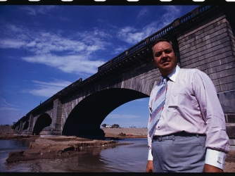 C.V. Wood, president of the McCulloch Corporation standing under the almost London Bridge near Lake Havasu City. (Credit: Bettmann / Getty Images)