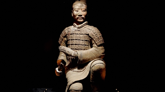 The figure of a kneeling archer on display at the British Museum.