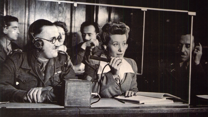 Interpreters providing simultaneous translations at the trials.