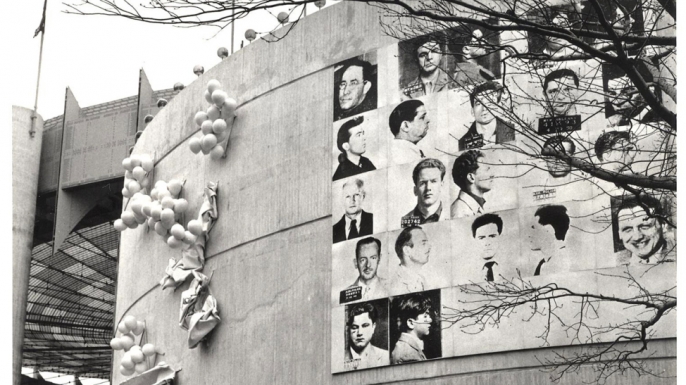 Andy Warhol's "13 Most Wanted Men" hanging outside the New York State Pavillion at the 1964 World's Fair.
