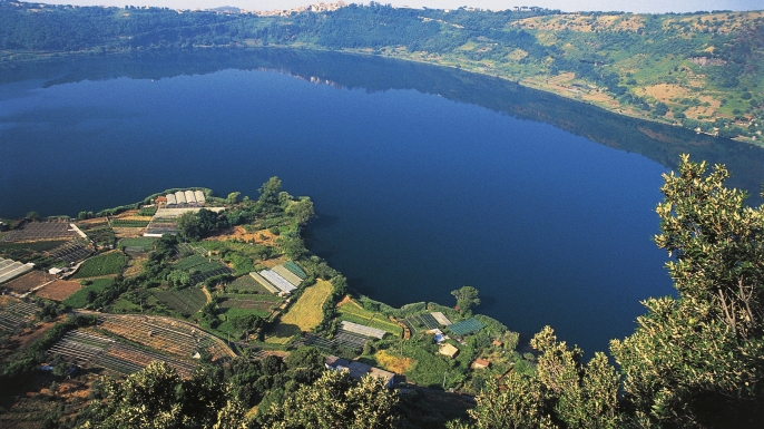 View of Lake Nemi, Genzano di Roma in the background, Lazio, Italy. (Credit: DeAgostini/Getty Images)
