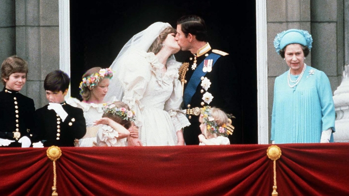 Prince Charles And Princess Diana kissing on the balcony of Buckingham Palace on their wedding day, July 29, 1981. (
