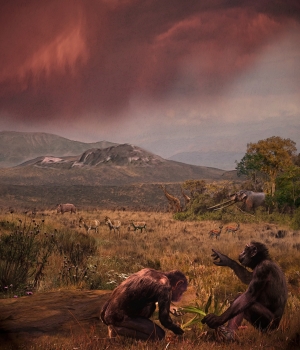 l Graeco (Graecopithecus freybergi) lived 7.2 million years ago in the dust-laden savannah of the Athens Basin. This view from El Graeco’s place of discovery, Pyrgos Vassilissis, to the southeast over the plain of Athens and under a reddish cloud of Sahara dust; in the background: Mount Hymettos and Mount Lykabettos. Painting by Chicago-based artist Velizar Simeonovski according to scientific instructions of Madelaine Böhme and Nikolai Spassov.