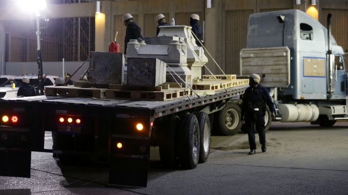 Workers dismantle the Liberty Place monument on April 24, 2017. It was removed overnight in an attempt to avoid disruption from supporters who want the monuments to stay.