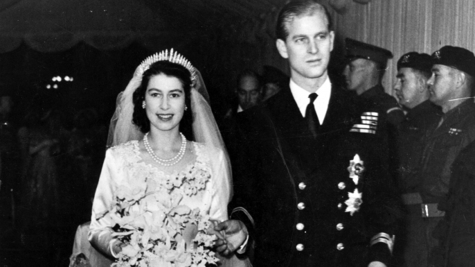 Queen Elizabeth II, as Princess Elizabeth, and her husband the Duke of Edinburgh, styled Prince Philip in 1957, on their wedding day. She became queen on her father King George VI's death in 1952. (Photo by Hulton Archive/Getty Images)