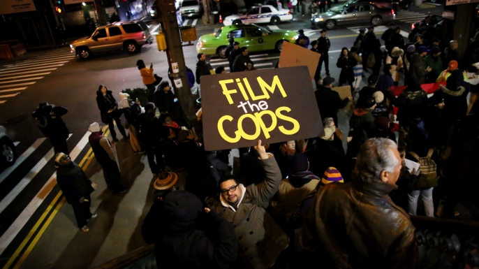 People gather on E. 125th St. during a protest December 4, 2014 in New York City. Protests began after a Grand Jury decided to not indict officer Daniel Pantaleo. (Credit: Yana Paskova/Getty Images)