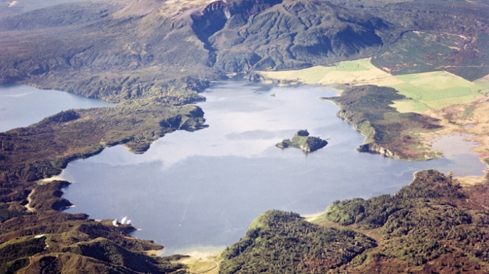 Aerial view of Lake Rotomahana with Mt. Tarawera in the background. (