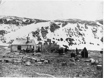 The huts as photographed on the arrival of the Scott's Discovery expedition at Cape Adare in 1902. (Credit: Antarctic Heritage Trust)