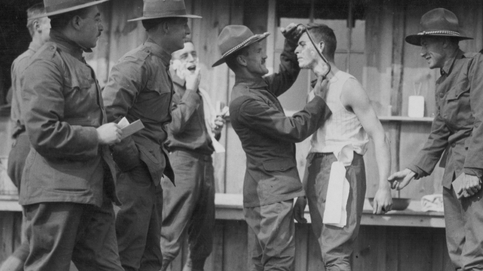 A soldier being shaved at a U.S. military camp at Plattsburg, New York during World War I. (Credit: Paul Thompson/FPG/Getty Images)