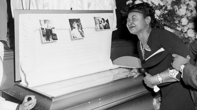 Mamie Mobley, mother of Emmett Till, at her son's casket at a Chicago funeral home. Images of his battered body helped spark the civil rights movement. (Credit:Chicago Sun-Times/AP Photo)