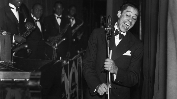 American jazz band leader and singer Cab Calloway at the Trocedero in London. (Credit: Fox Photos/Getty Images)
