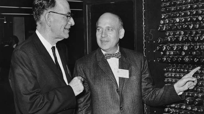 John Mauchly and Dr Presper Eckert Jr looking at a portion of ENIAC, which they co-designed in 1946. (Credit: Hulton Archive/Getty Images)