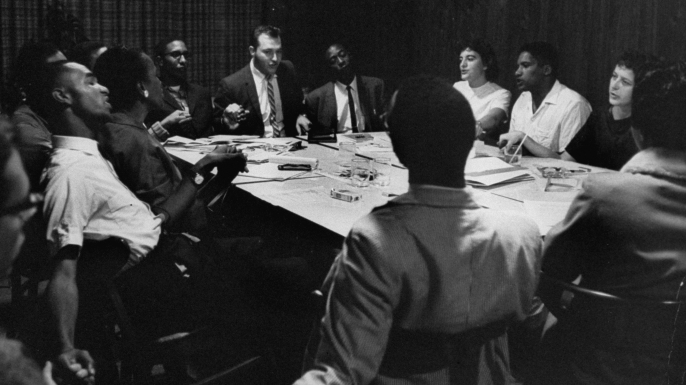 Student Non-violent Coordinating Committee planning freedom rides while singing 'We Will Overcome'. (Credit: Lynn Pelham/The LIFE Images Collection/Getty Images)