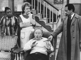 Isabel Sanford (left) and Sherman Hemsley (right) guest starring on "All in the Family," before the premiere of their popular spin-off, "The Jeffersons." (