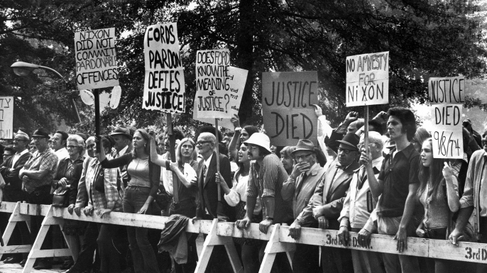 Protestors opposed to President Gerald Ford's pardon of former President Richard Nixon after the Watergate affair. (Credit: Bill Pierce/The LIFE Images Collection/Getty Images)
