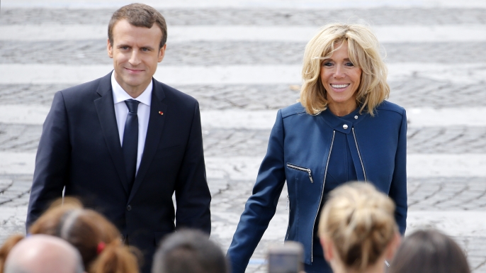 French President Emmanuel Macron and his wife Brigitte Trogneux attending the traditional Bastille day military parade. (Credit: Thierry Chesnot/Getty Images)